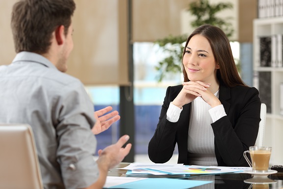 Businesswoman attending a client at office